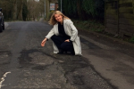 Esther McVey inspects a road with potholes in Cheshire East