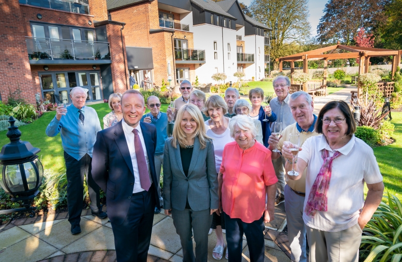 Residents join Esther to toast the development's second birthday